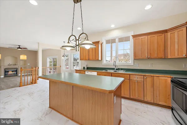 a view of an empty room with a ceiling fan