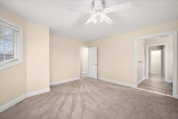 a view of a lake with a table and chairs