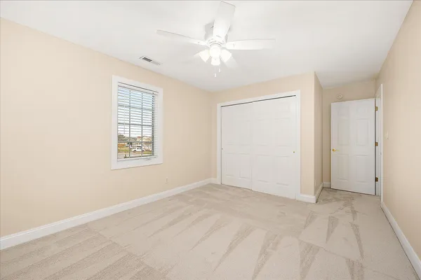 a view of a swimming pool with outdoor seating