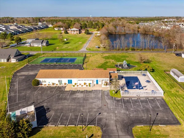 a view of a livingroom with a fireplace and a ceiling fan