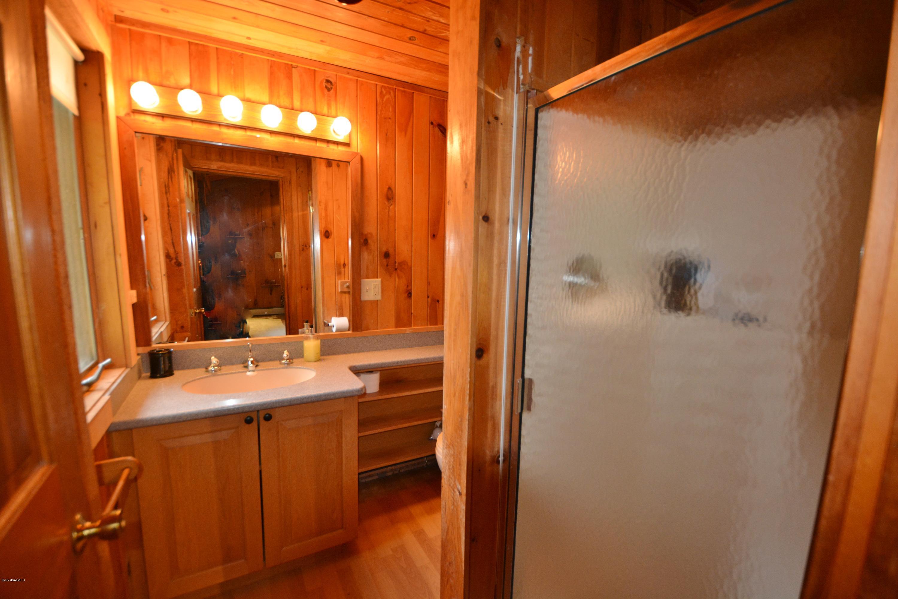 262 North Beech Plain Road Sandisfield, MA 01255 - Photo 11 of 23 a bathroom with a sink and mirror