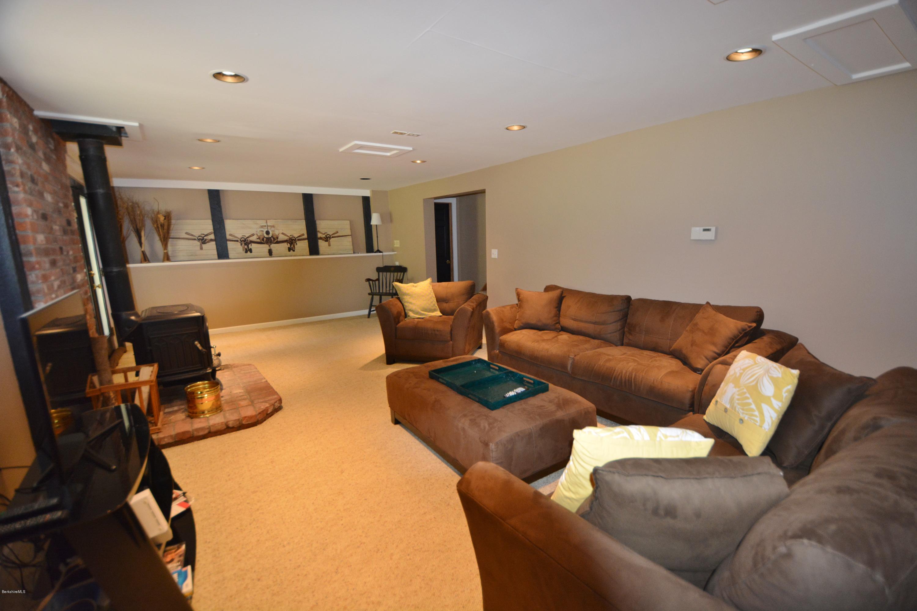 262 North Beech Plain Road Sandisfield, MA 01255 - Photo 17 of 23 a living room with furniture and a flat screen tv