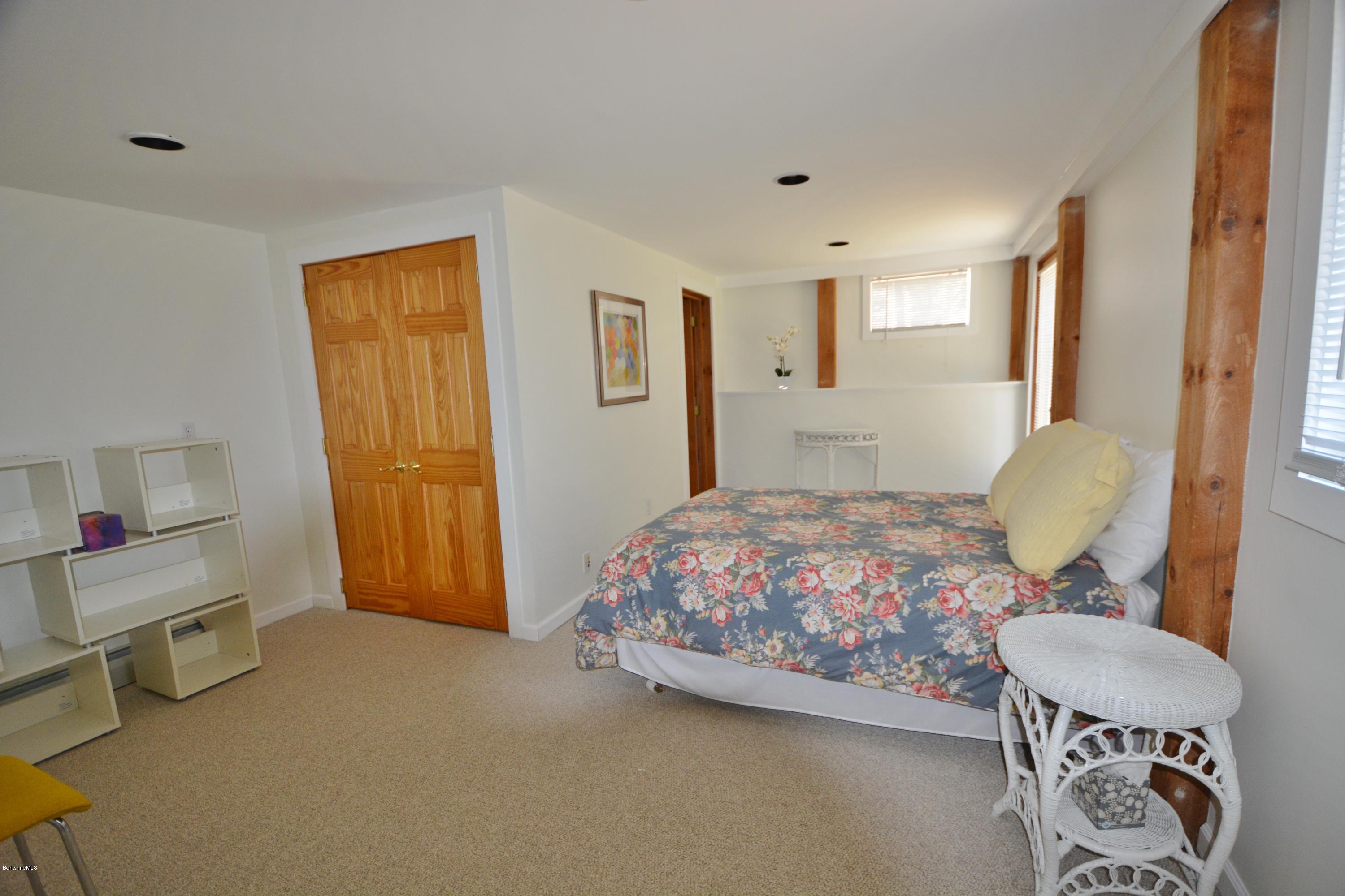 262 North Beech Plain Road Sandisfield, MA 01255 - Photo 18 of 23 a bedroom with a bed and a dresser