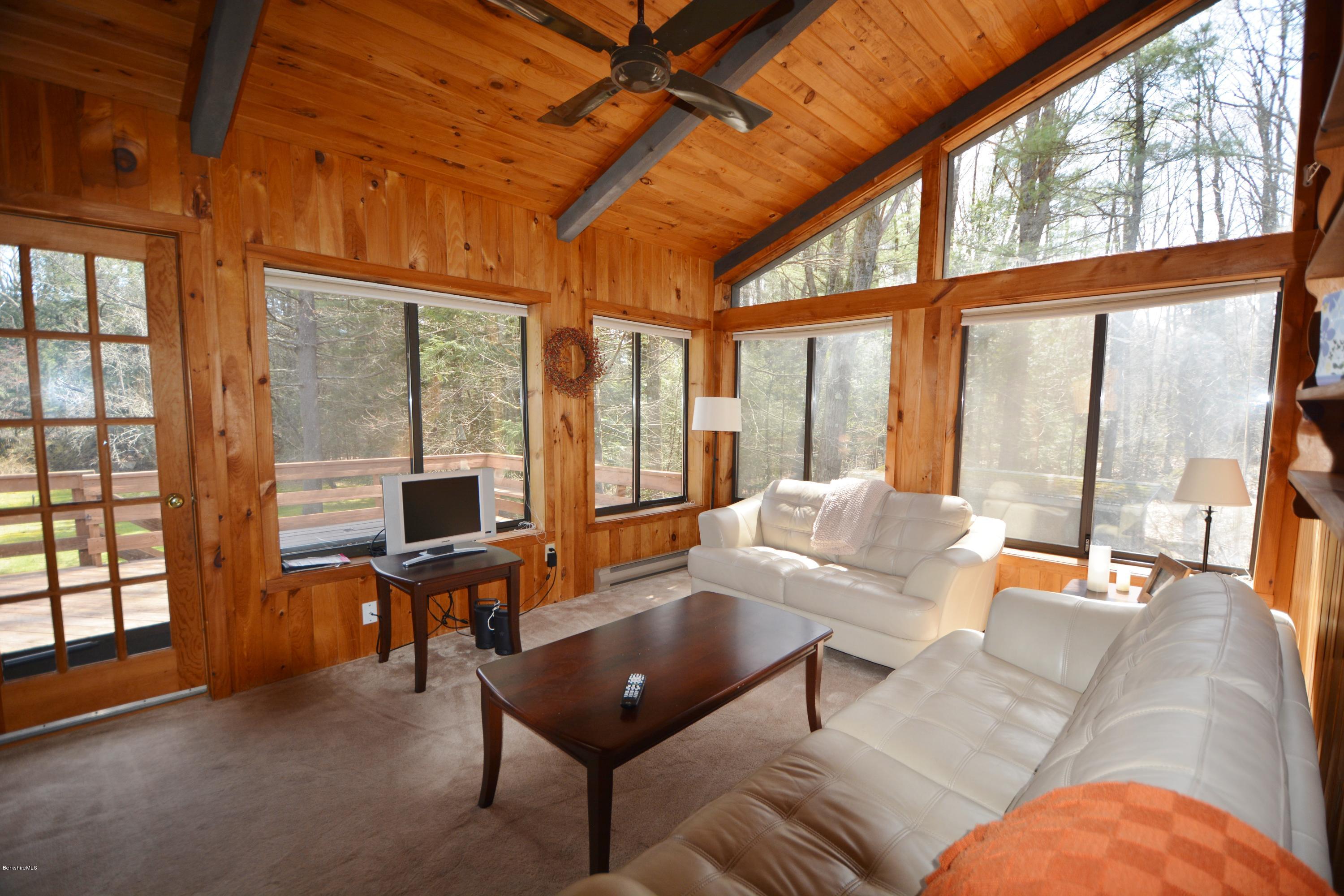 262 North Beech Plain Road Sandisfield, MA 01255 - Photo 4 of 23 a living room with furniture and floor to ceiling windows