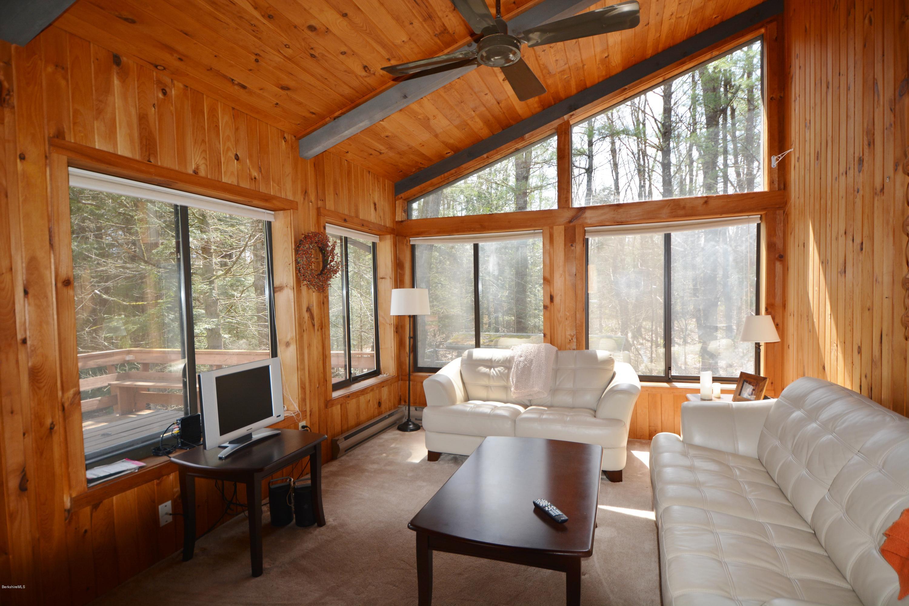 262 North Beech Plain Road Sandisfield, MA 01255 - Photo 6 of 23 a living room with furniture tv and a large window