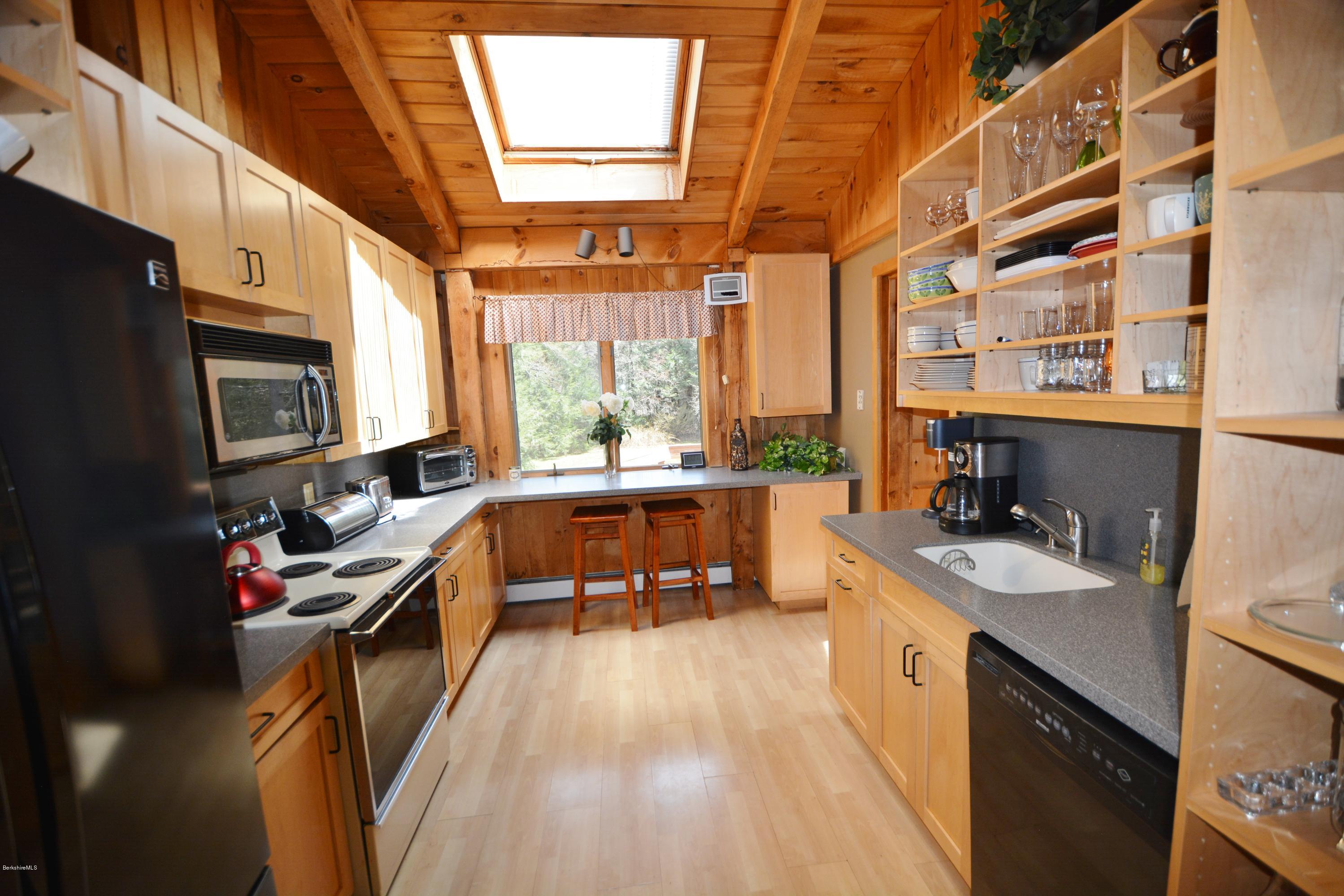 262 North Beech Plain Road Sandisfield, MA 01255 - Photo 8 of 23 a kitchen with a sink stove and microwave