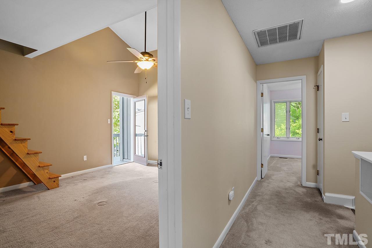 4341 Sunscape Lane Raleigh, NC 27613 - Photo 19 of 32 a view of a room with wooden floor and windows