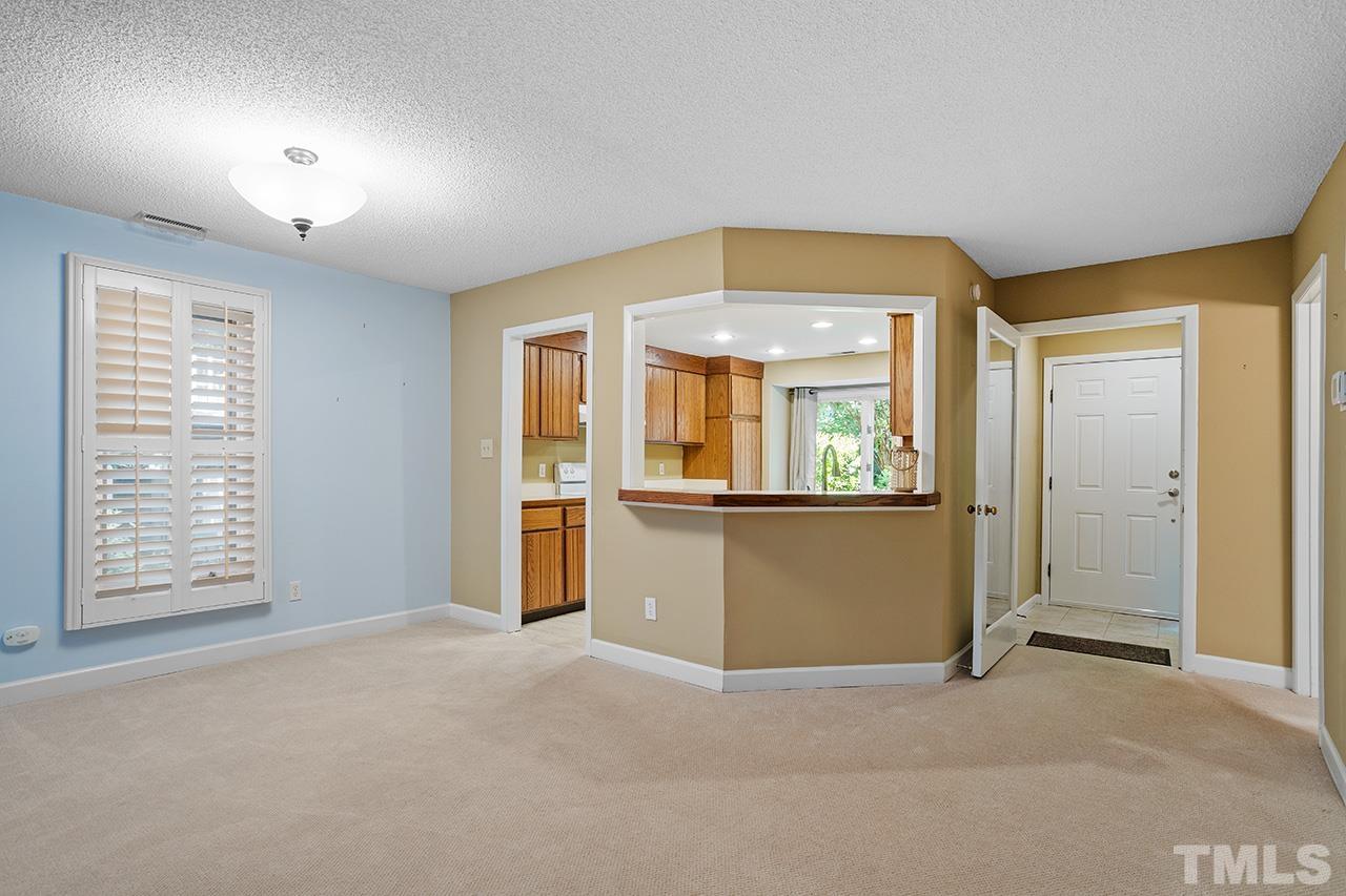 4341 Sunscape Lane Raleigh, NC 27613 - Photo 5 of 32 an empty room with windows and entrance