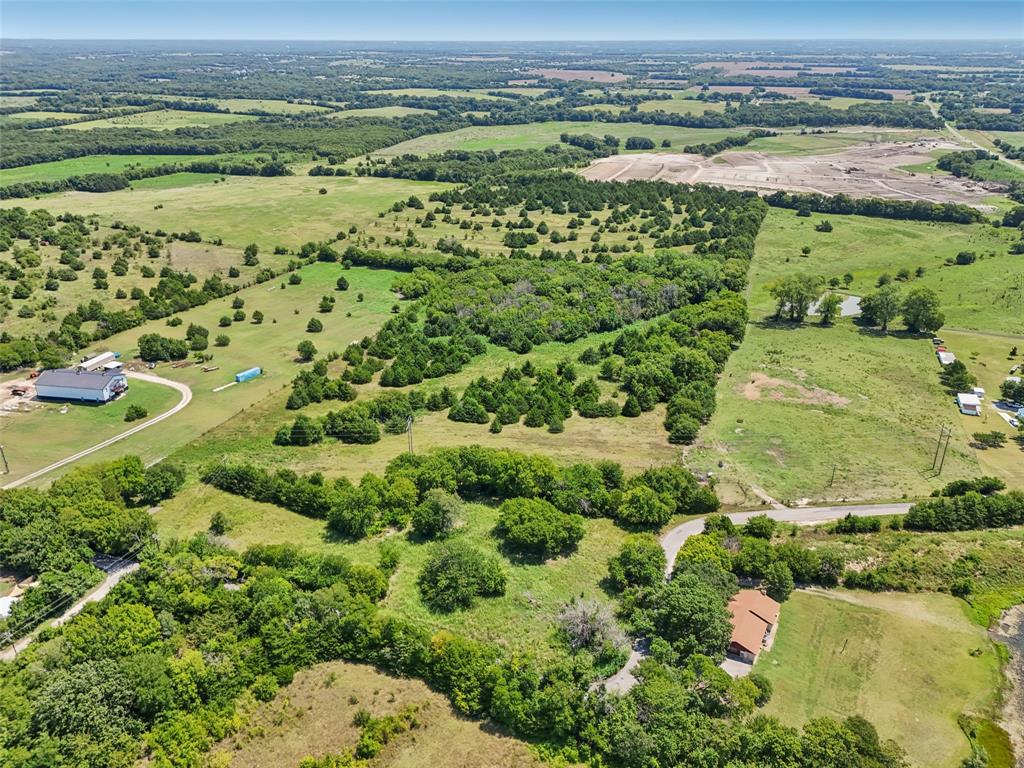 1456 Willy Vester Road Van Alstyne, TX 75495 - Photo 2 of 13 an aerial view of a houses with a lake view