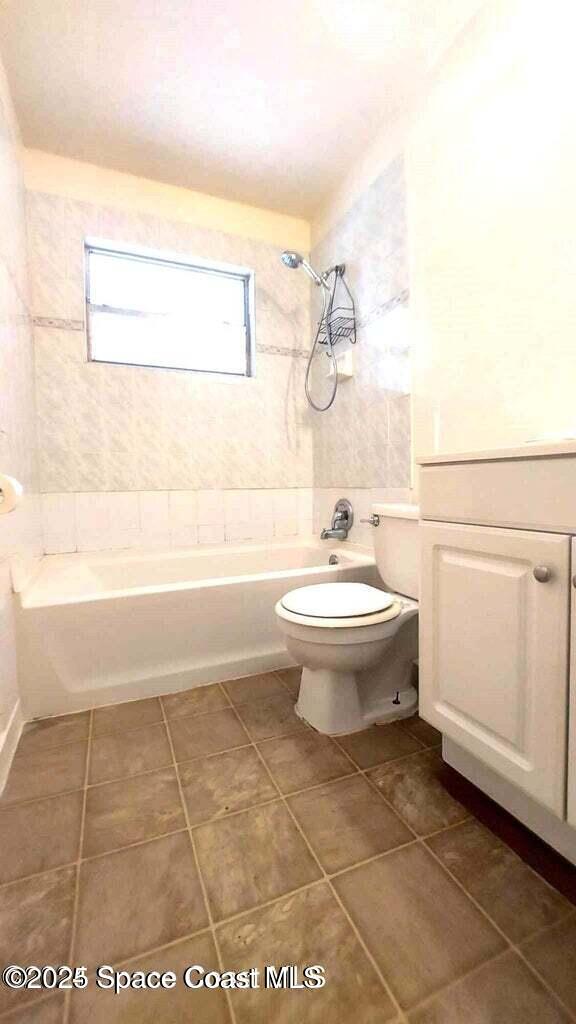 2441 Uranus Drive Cocoa, FL 32926 - Photo 7 of 8 a bathroom with a toilet a sink and mirror