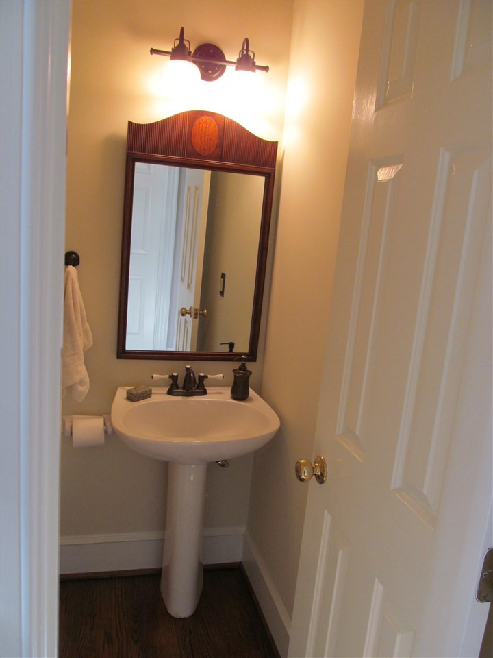 2506 Mayview Road Raleigh, NC 27607 - Photo 6 of 29 The powder room is located on the entry hall jsut before you step into the kitchen. Powder room