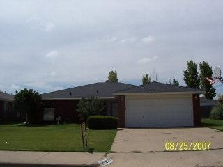 6117 8th Street Lubbock, TX 79416 - Photo 1 of 1 a front view of a house with a garden