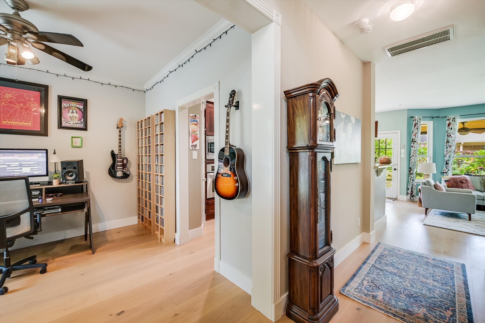 6456 Ruxton Lane Austin, TX 78749 - Photo 5 of 30 Blonde hardwood floors flow seamlessly between rooms, offering an open-concept living experience.