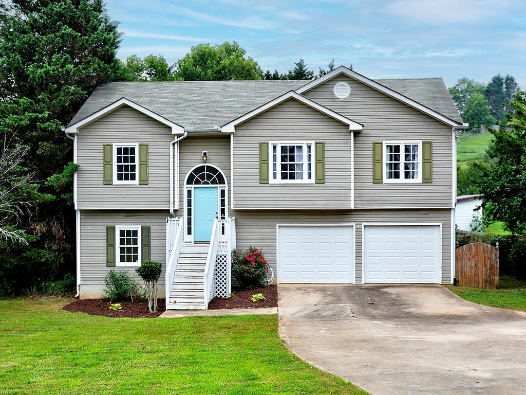 30 Magnolia Court Rydal, GA 30171 - Photo 1 of 1 a front view of a house with a yard and garage
