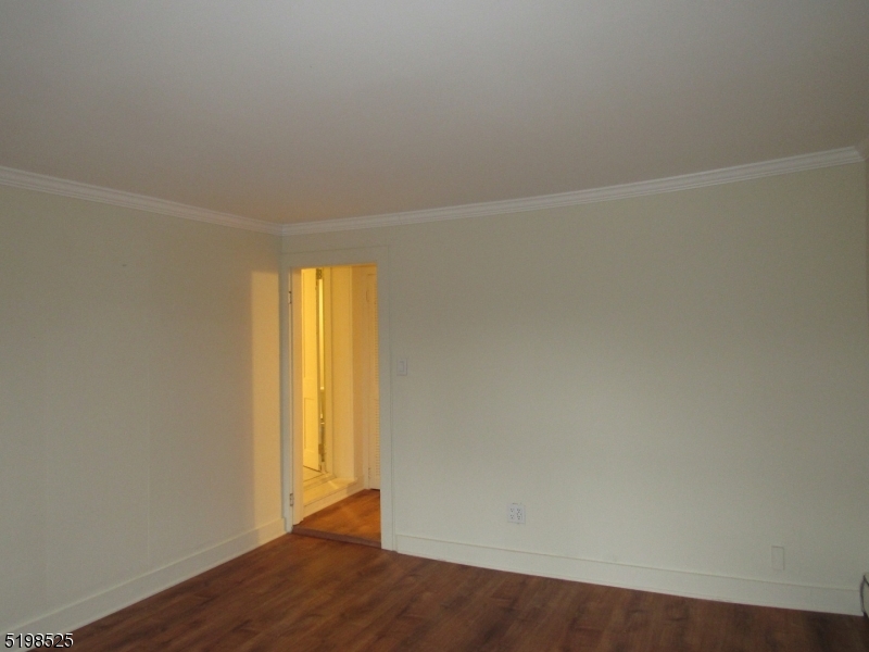 49 Bridge Street Frenchtown, NJ 08825 - Photo 11 of 12 an empty room with wooden floor and windows
