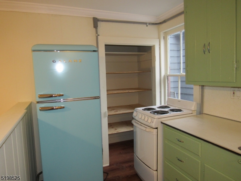 49 Bridge Street Frenchtown, NJ 08825 - Photo 2 of 12 a utility room with cabinets and washer