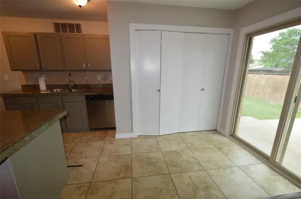a kitchen with a sink a counter top space and appliances