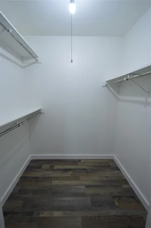 a view of an empty walk in closet