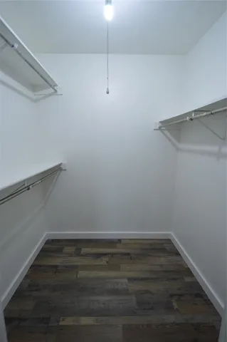 a view of an empty walk in closet