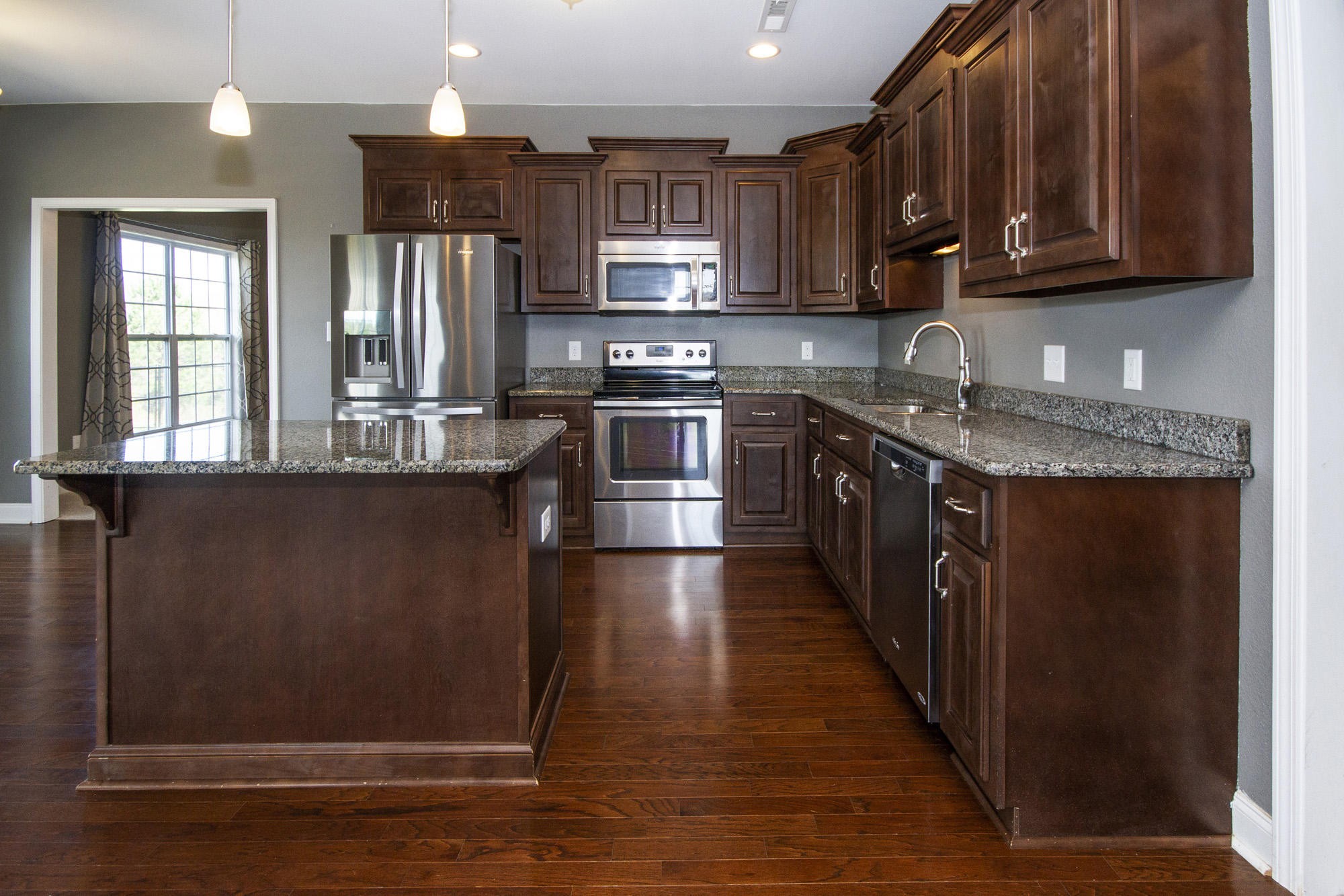7480 Dry Valley Road Loudon, TN 37774 - Photo 13 of 27 a kitchen with stainless steel appliances granite countertop a stove a sink and a refrigerator