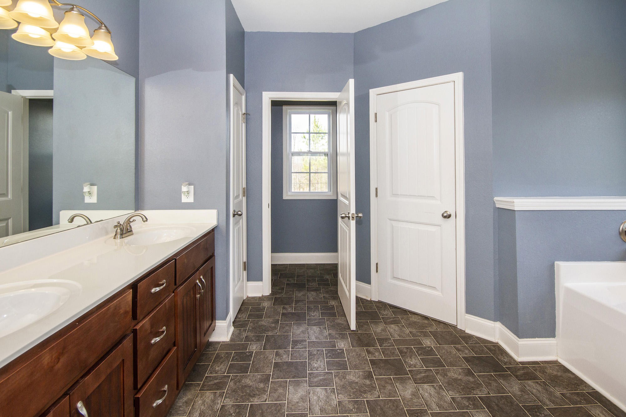 7480 Dry Valley Road Loudon, TN 37774 - Photo 17 of 27 a spacious bathroom with a sink and a mirror
