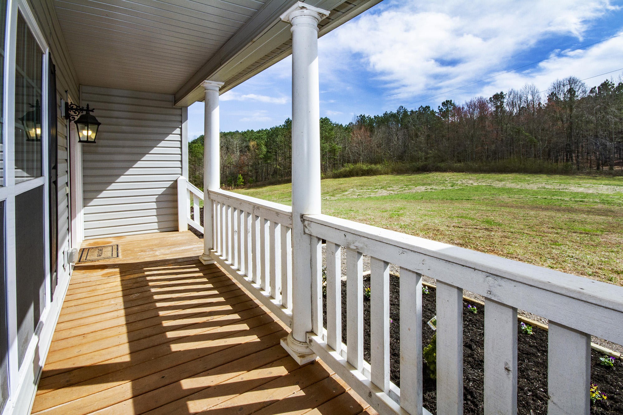 7480 Dry Valley Road Loudon, TN 37774 - Photo 2 of 27 a view of a porch with wooden floor and fence