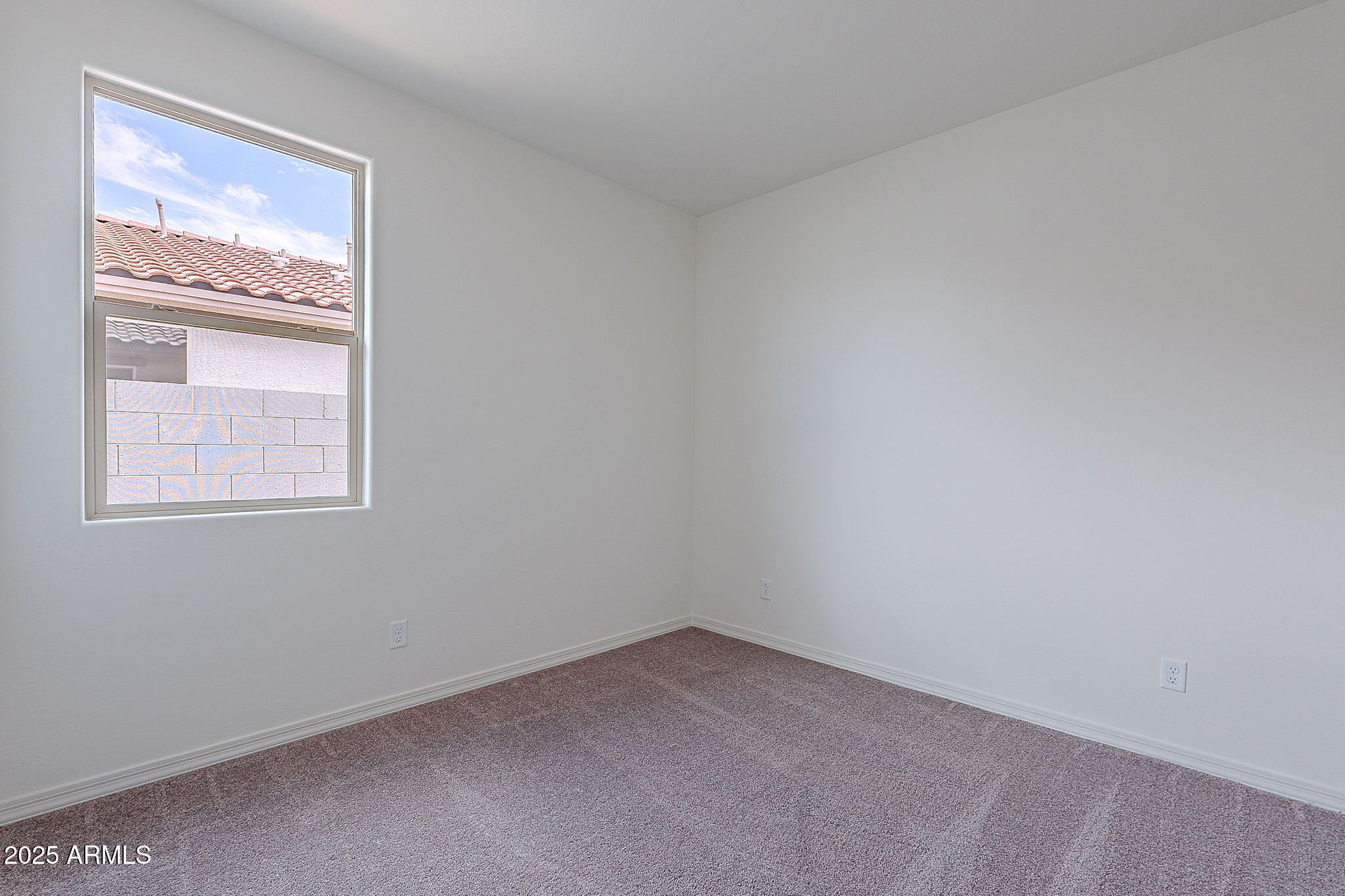 40025 Bunker Drive Maricopa, AZ 85138 - Photo 12 of 18 an empty room with a window
