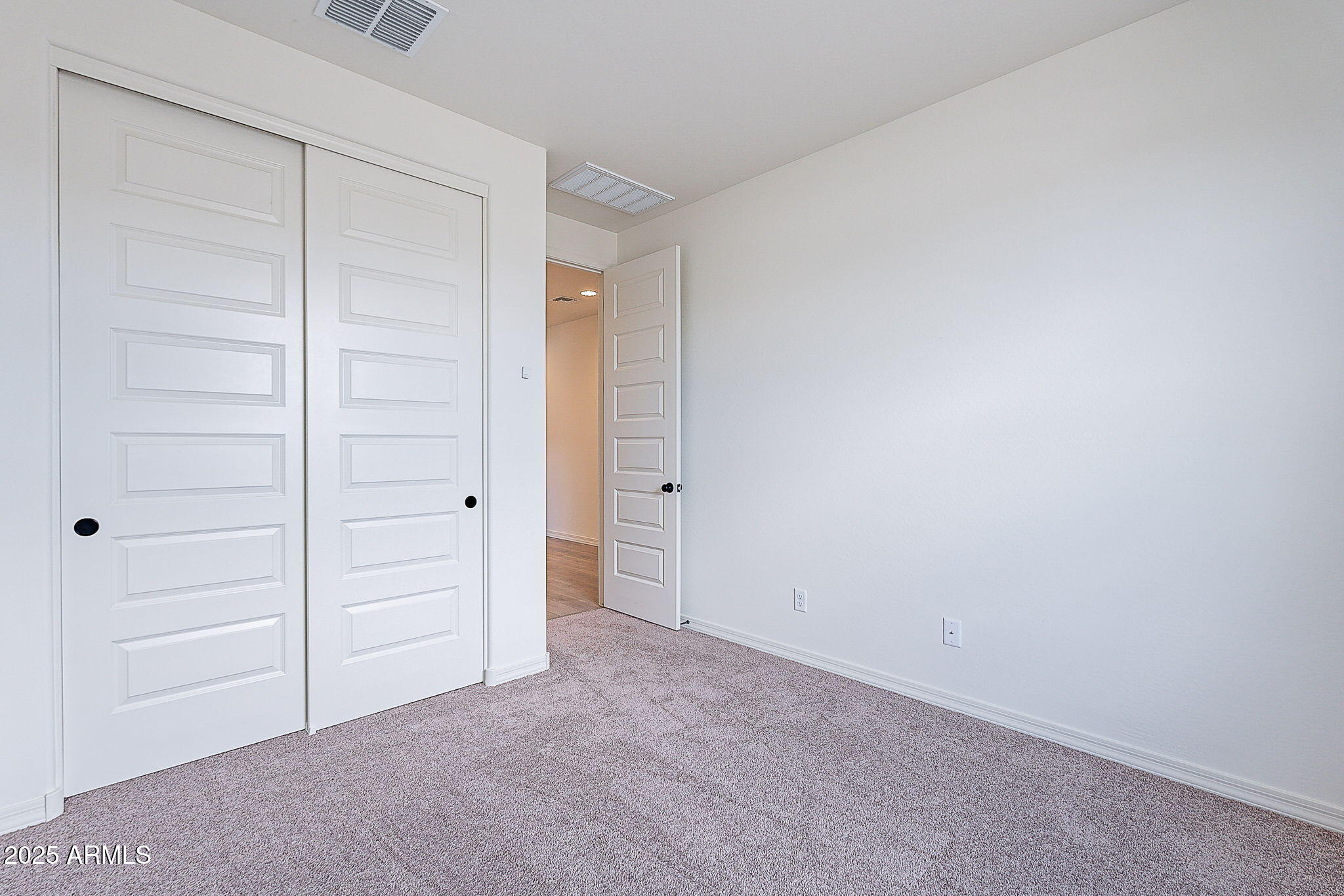 40025 Bunker Drive Maricopa, AZ 85138 - Photo 10 of 18 an empty room with closet area