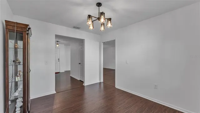 a very nice looking hallway with wooden floor