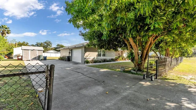 a view of a house with a tree