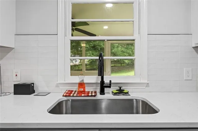 a bathroom with a sink and a bathtub