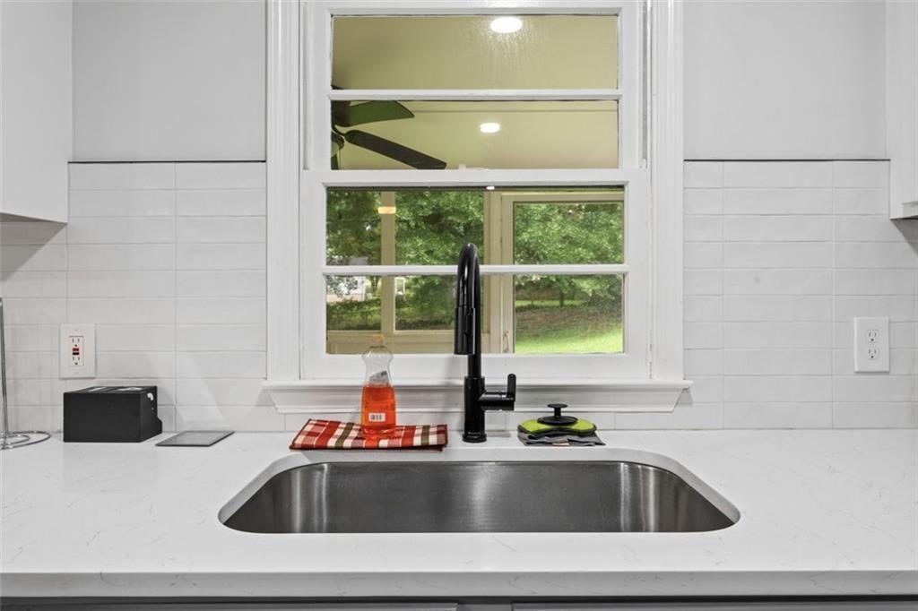 1326 Stella Circle Southwest Mableton, GA 30126 - Photo 12 of 26 a bathroom with a sink and a bathtub