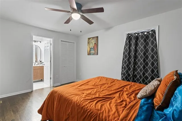 a bedroom with a bed and a chair