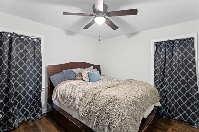 a large bed sitting in a bedroom next to a lamp
