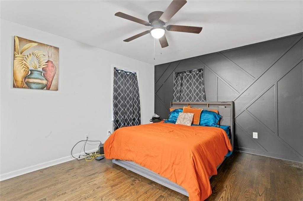 1326 Stella Circle Southwest Mableton, GA 30126 - Photo 16 of 26 a bedroom with a bed and a painting on the wall