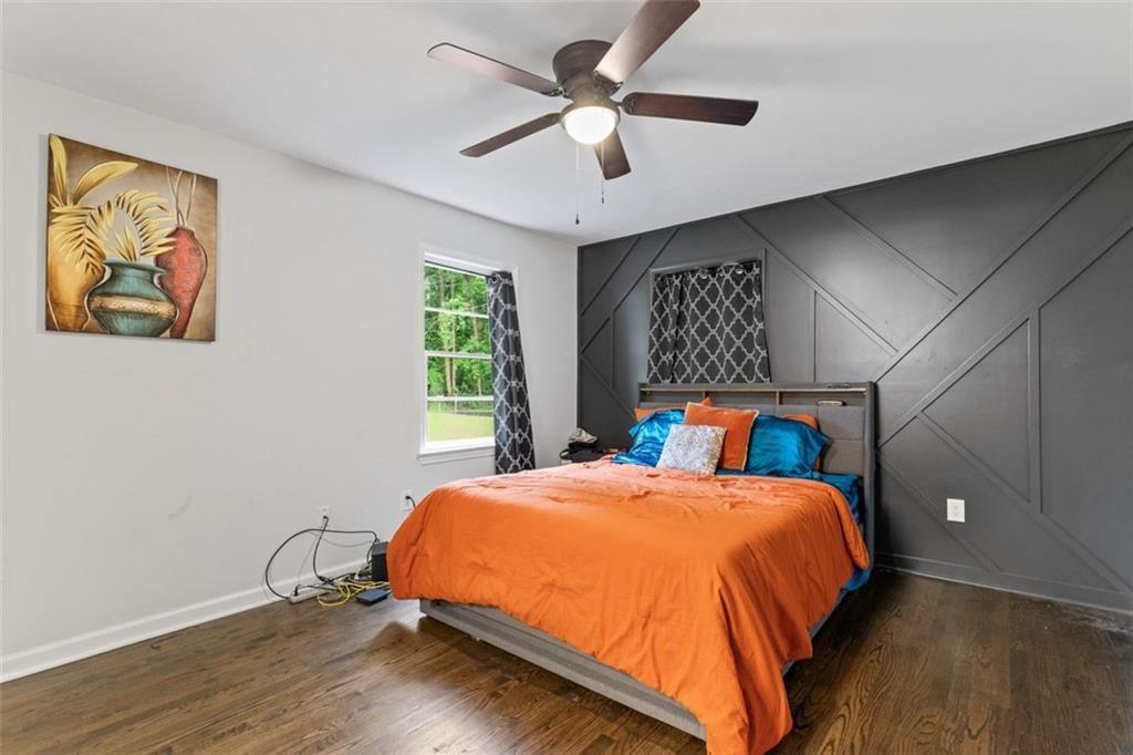 1326 Stella Circle Southwest Mableton, GA 30126 - Photo 17 of 26 a bed sitting in a bedroom next to a window