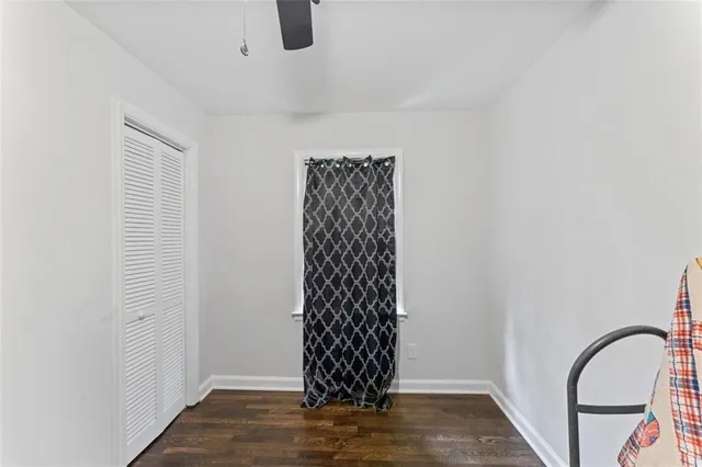 a view of a livingroom with wooden floor