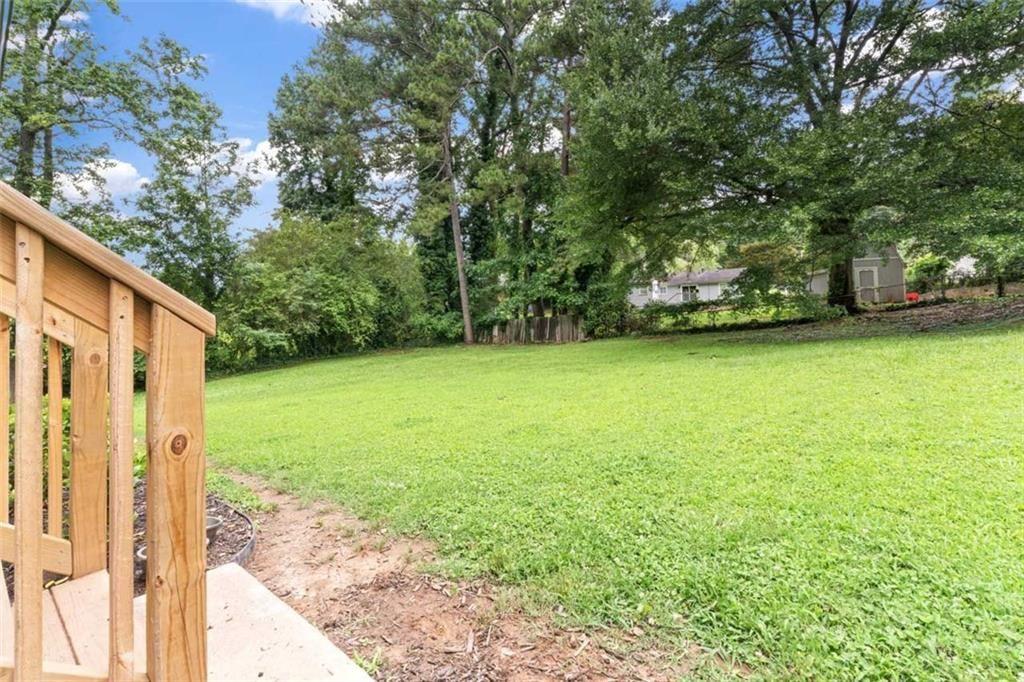 1326 Stella Circle Southwest Mableton, GA 30126 - Photo 23 of 26 a view of a yard with a trees