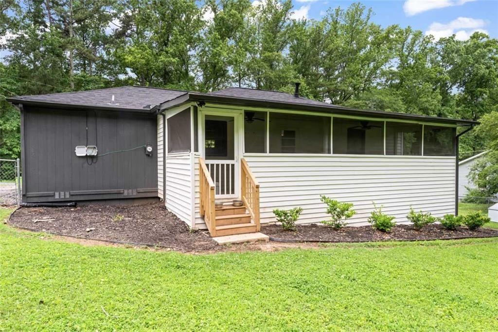 1326 Stella Circle Southwest Mableton, GA 30126 - Photo 24 of 26 a backyard of a house with table and chairs
