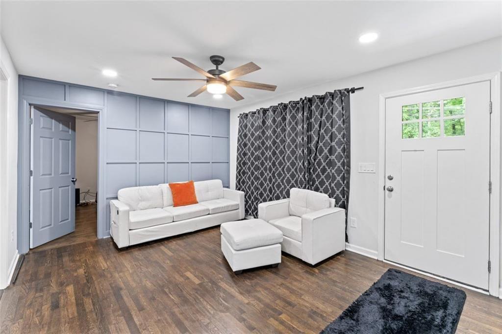 1326 Stella Circle Southwest Mableton, GA 30126 - Photo 6 of 26 a living room with furniture and a wooden floor