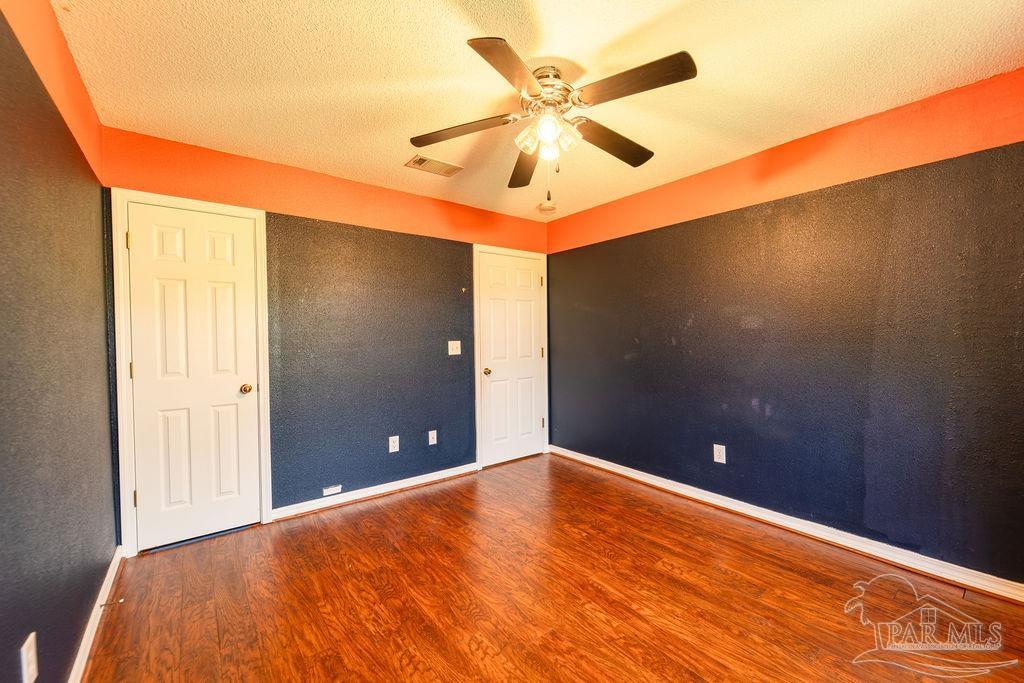 4907 Chads Circle Pace, FL 32571 - Photo 19 of 40 a view of a room with a ceiling fan