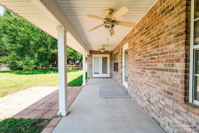 a view of a porch with a garden