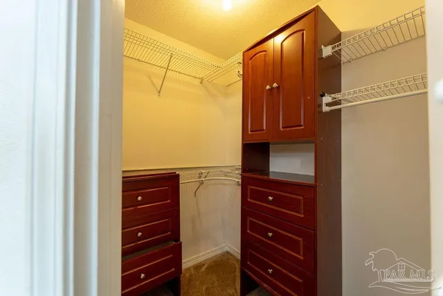 a bathroom with a shower and a sink