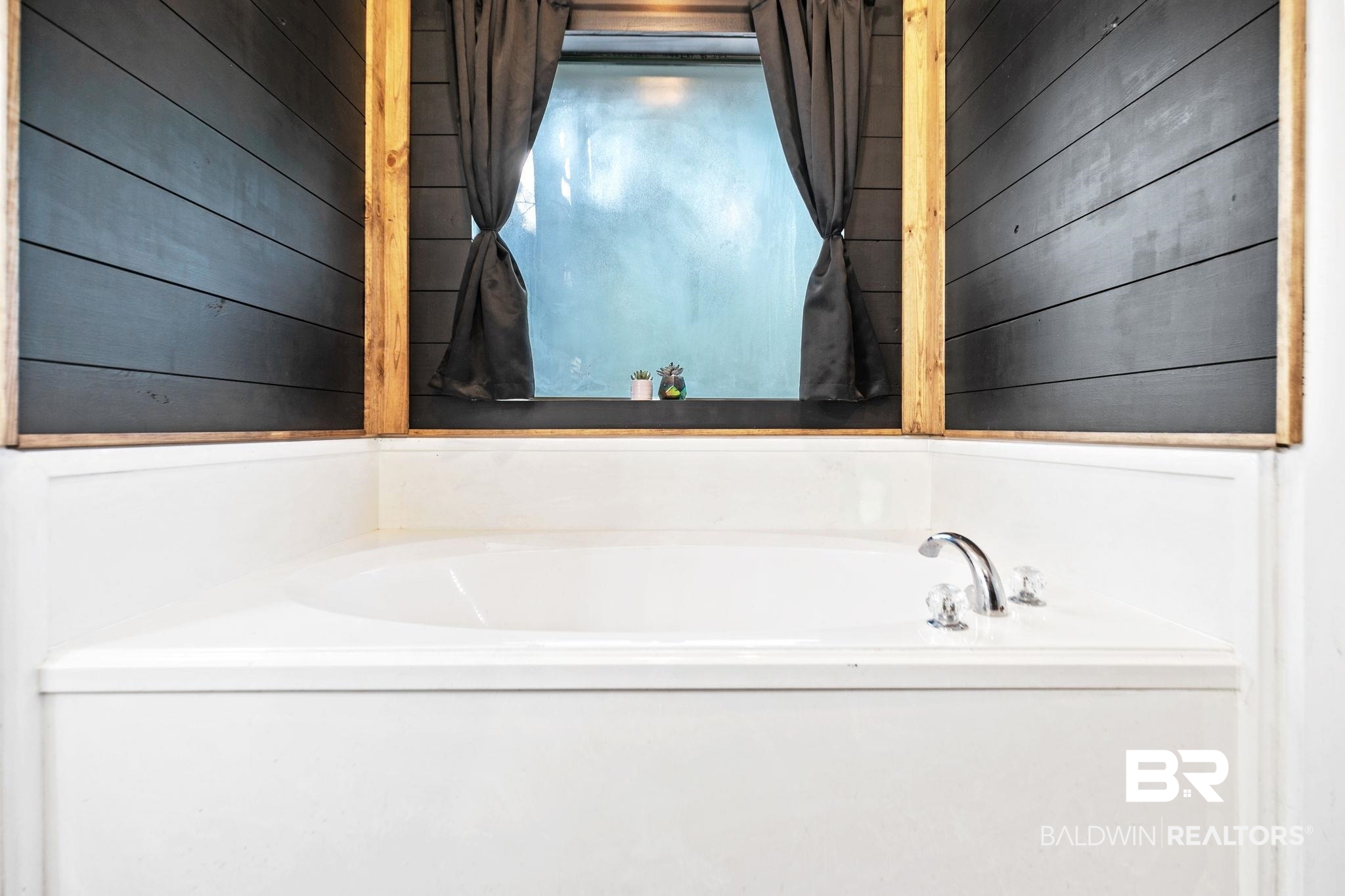 10550 Patrick Avenue Grand Bay, AL 36541 - Photo 28 of 43 Bathroom featuring wood walls and a bath