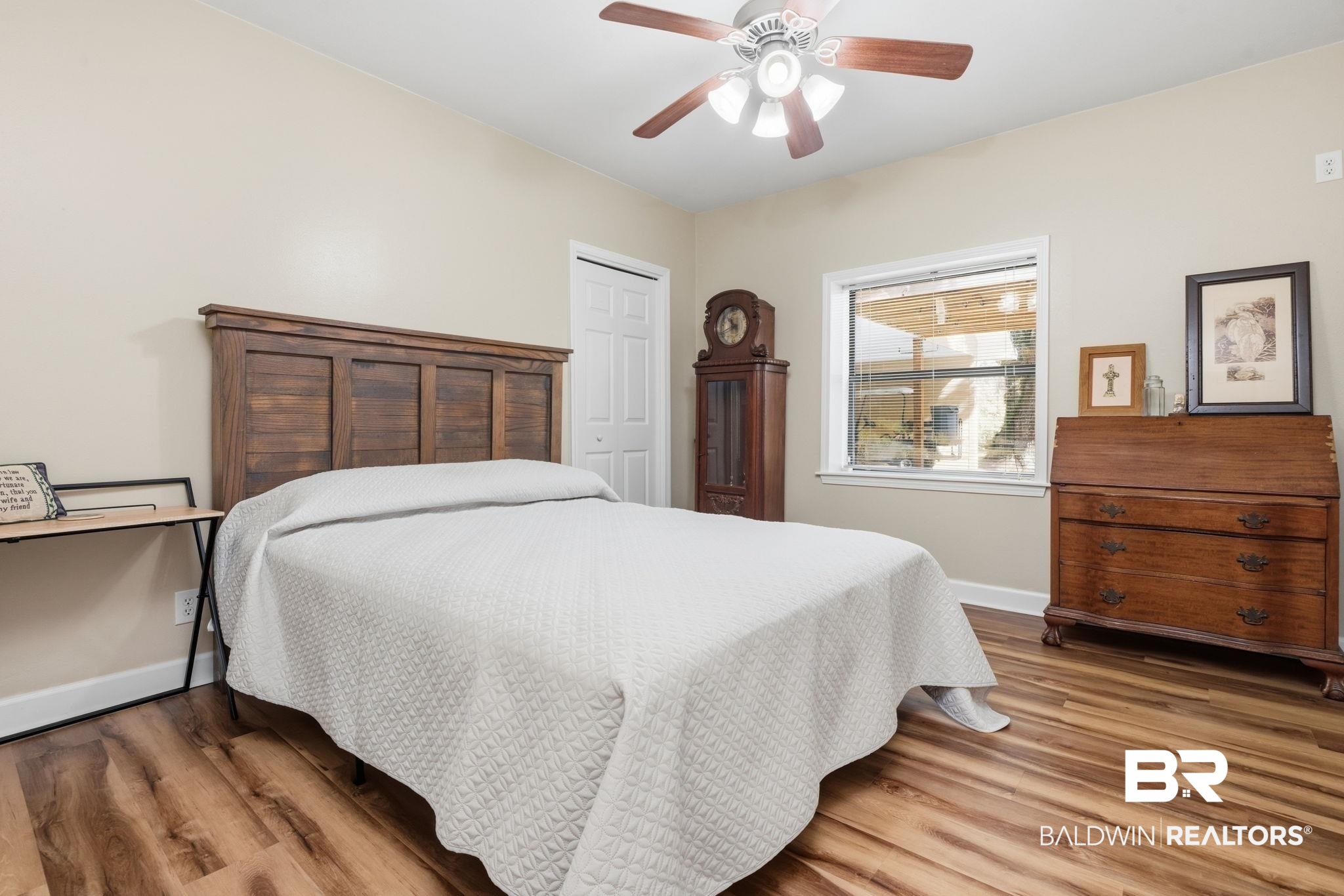 15025 Bellingrath Road Coden, AL 36523 - Photo 51 of 79 Bedroom with wood finished floors, a closet, and ceiling fan
