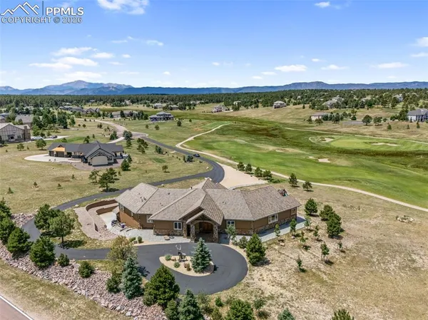 an aerial view of a house with a lake view