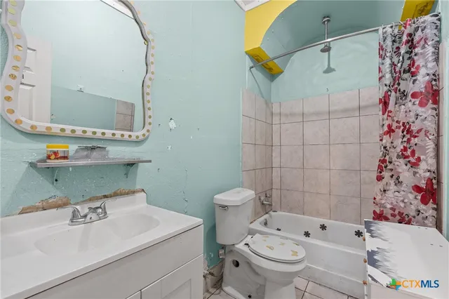 a kitchen with stainless steel appliances granite countertop a stove and a refrigerator