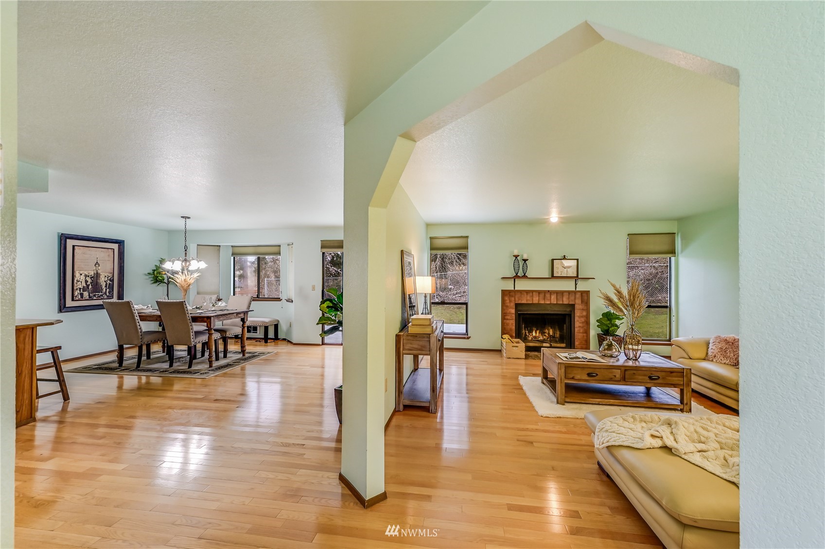 1217 225th Place Southwest Bothell, WA 98021 - Photo 11 of 21 a living room with fireplace furniture and a dining table