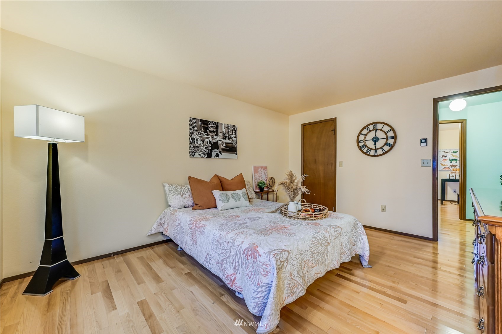 1217 225th Place Southwest Bothell, WA 98021 - Photo 12 of 21 a bedroom with a bed and a lamp on table