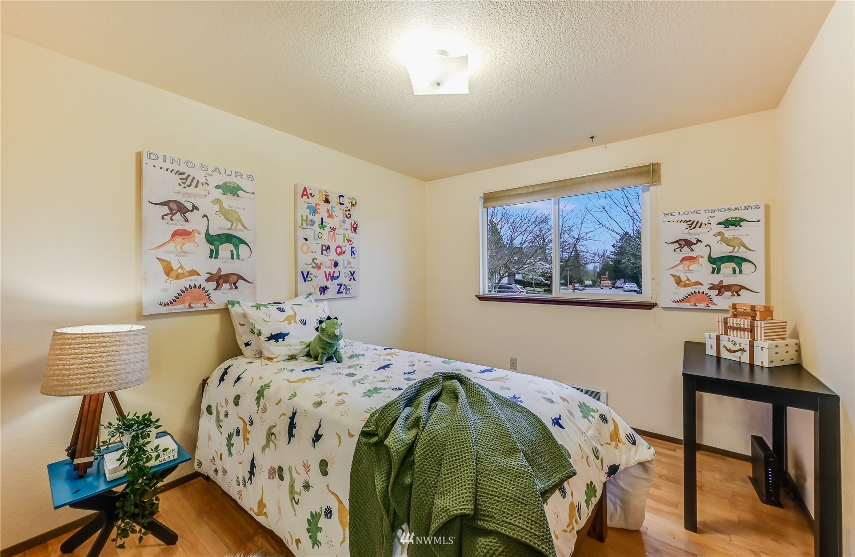 1217 225th Place Southwest Bothell, WA 98021 - Photo 16 of 21 a bedroom with a bed and a table in it